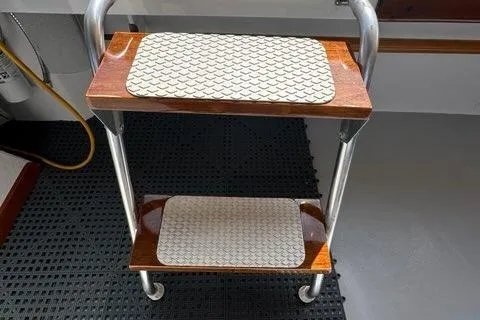 Slide: The Image of 1987 Holland 32 boat interior with wooden handrail and white finish. - 56