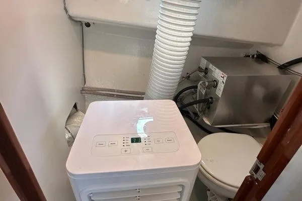 Slide: The Image of Engine room of 1987 Holland 32 boat with mechanical equipment and wiring. - 63