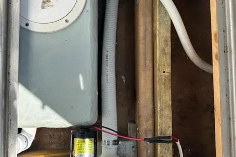 Slide: The Image of Electrical wiring inside a 1987 Holland 32 boat, showcasing complex cable arrangement. - 65