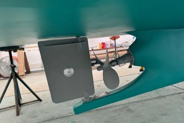 Slide: The Image of Underwater view of 1987 Holland 32 boat's propeller and rudder in a workshop. - 71