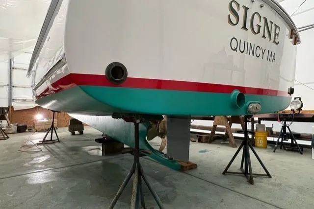 Slide: The Image of 1987 Holland 32 boat named "Signe" in Quincy, MA, on stands in a workshop. - 72