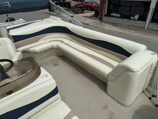 Slide: The Image of 2008 Bennington 2277FSi boat interior with cream and navy seating. - 14