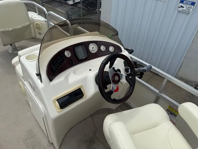 Slide: The Image of 2008 Bennington 2277FSi boat dashboard with steering wheel and control panel. - 17