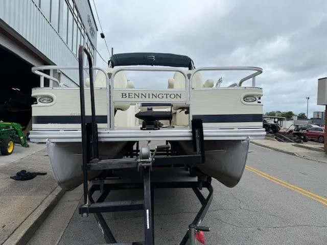 Slide: The Image of 2008 Bennington 2277FSi pontoon boat on trailer, parked outside a building. - 3