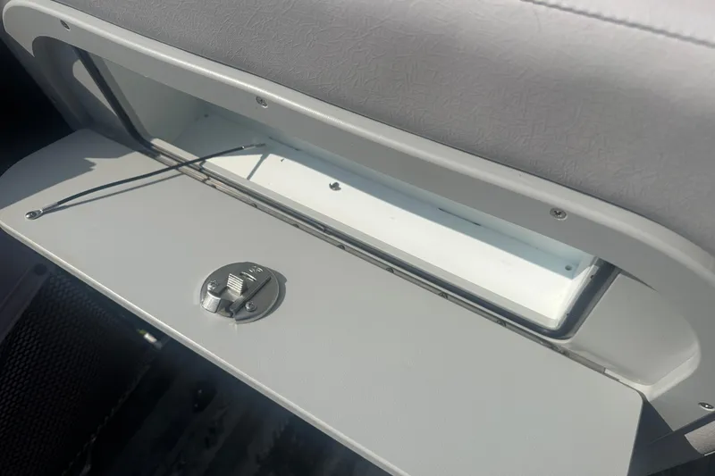 Slide: The Image of Open storage compartment in 2020 Crest Caribbean RS 250 SLS boat. - 17