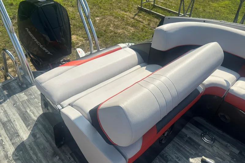 Slide: The Image of 2020 Crest Caribbean RS 250 SLS boat interior with Mercury engine, featuring stylish seating. - 23