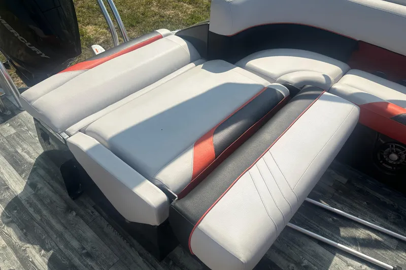 Slide: The Image of 2020 Crest Caribbean RS 250 SLS boat seating with red and black accents. - 24