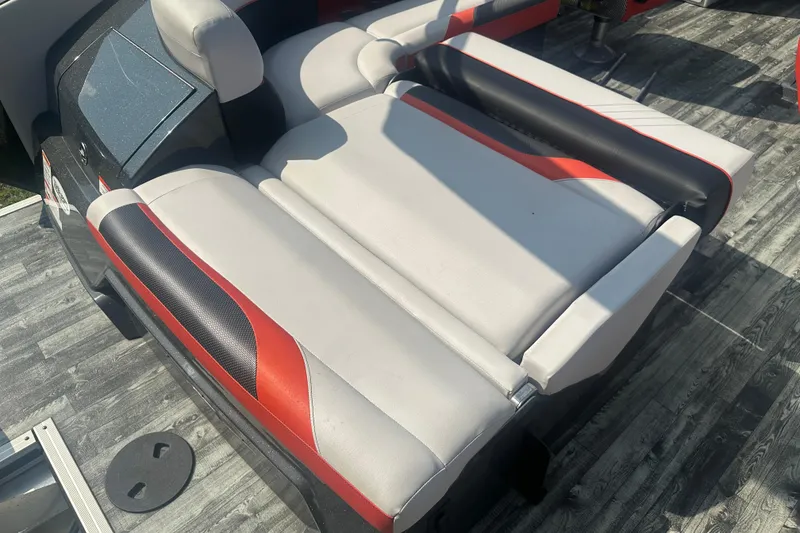 Slide: The Image of 2020 Crest Caribbean RS 250 SLS boat seating with red, black, and white upholstery. - 25