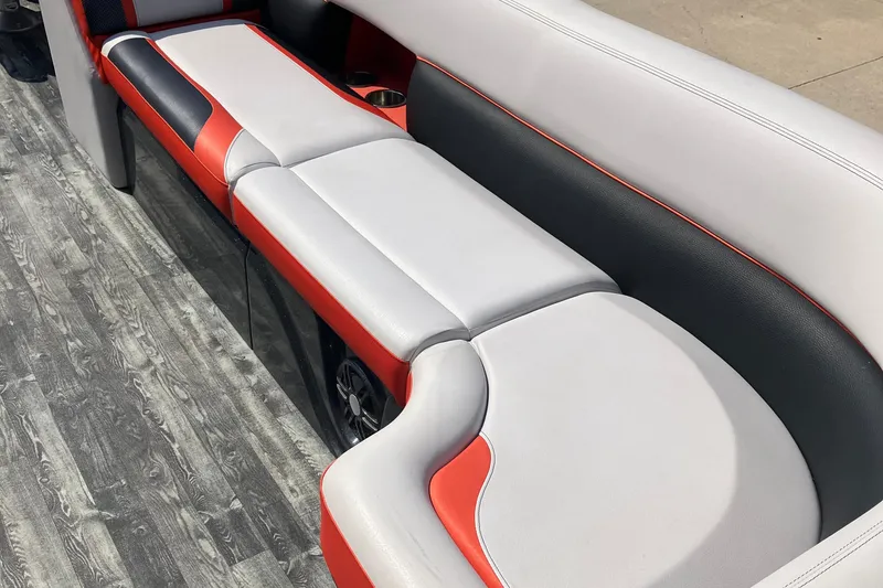 Slide: The Image of 2020 Crest Caribbean RS 250 SLS boat interior with stylish red, black, and white seating. - 3