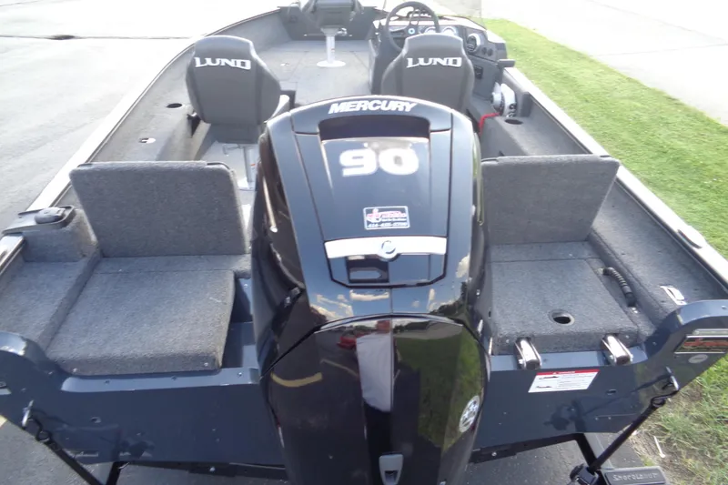 Slide: The Image of 2025 Lund 1675 Adventure SS boat with Mercury 90 engine, featuring spacious seating and modern design. - 20