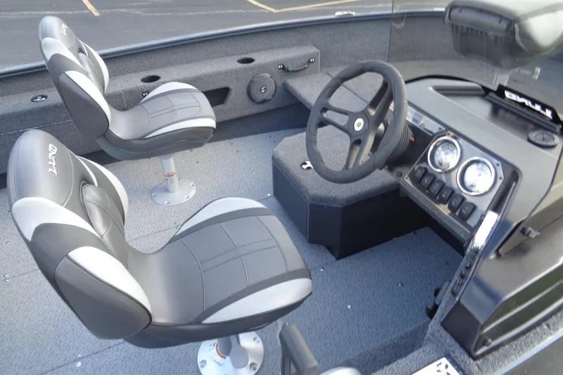 Slide: The Image of 2025 Lund 1675 Adventure SS boat interior with steering wheel and two seats. - 22