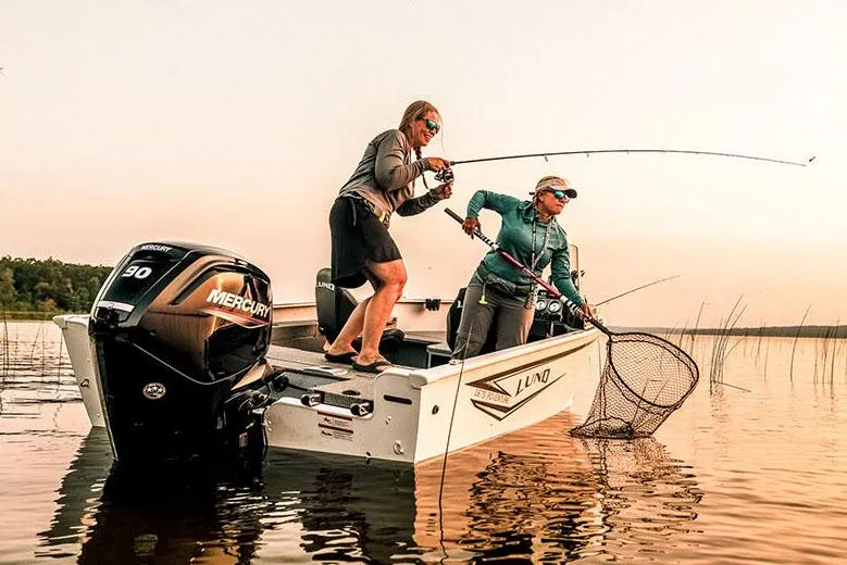 Slide: The Image of Manufacturer Provided Image: Two people fishing on a 2025 Lund 1675 Adventure SS boat at sunset. - 24