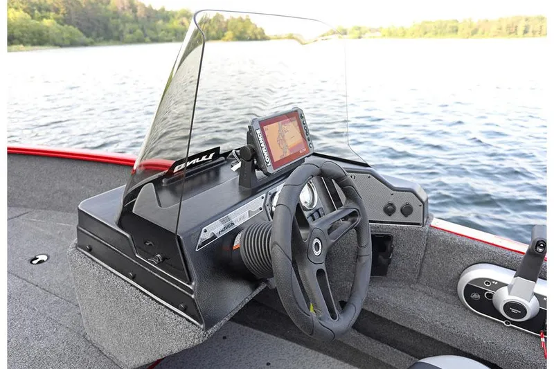 Slide: The Image of Manufacturer Provided Image: 2025 Lund 1675 Adventure SS boat dashboard with steering wheel and navigation system. - 26