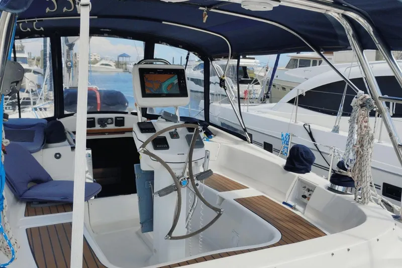 Slide: The Image of 2009 Hunter 50 Center Cockpit sailboat with modern navigation equipment and spacious seating. - 3