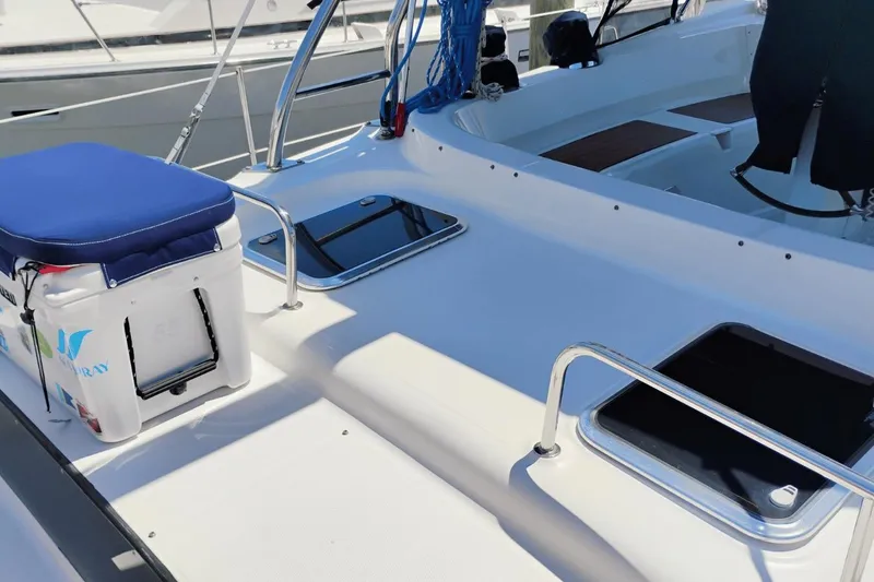 Slide: The Image of Hunter 50 Center Cockpit 2009 sailboat deck with seating and storage hatches. - 5