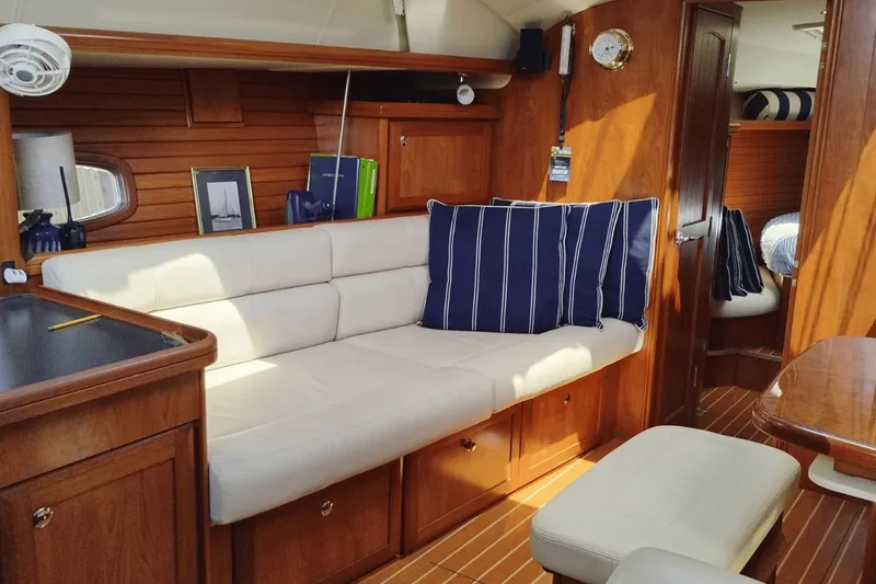 Slide: The Image of Interior of 2009 Hunter 50 Center Cockpit yacht with cozy seating and nautical decor. - 6