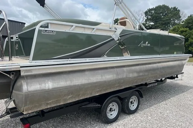 Slide: The Image of 2024 Avalon Platinum LSZ 2385 Elite pontoon boat on trailer, side view. - 2