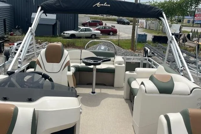 Slide: The Image of 2024 Avalon Platinum LSZ 2385 Elite pontoon boat with luxurious seating and sleek design. - 21