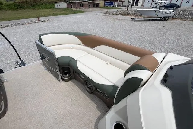 Slide: The Image of 2024 Avalon Platinum LSZ 2385 Elite boat interior with stylish seating and cup holders. - 22
