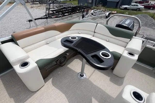 Slide: The Image of 2024 Avalon Platinum LSZ 2385 Elite pontoon boat interior with stylish seating and table. - 23