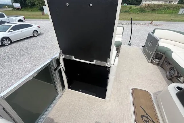 Slide: The Image of 2024 Avalon Platinum LSZ 2385 Elite boat interior with open storage compartment. - 24