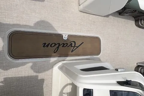 Slide: The Image of 2024 Avalon Platinum LSZ 2385 Elite boat deck with logo and seating area. - 25