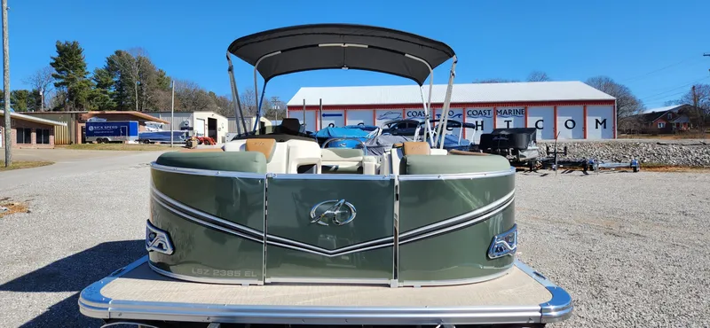 Slide: The Image of 2024 Avalon Platinum LSZ 2385 Elite pontoon boat, green exterior, parked outdoors. - 7