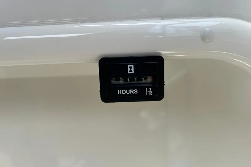 Slide: The Image of Hour meter reading 11 hours on a 2018 Stingray 191 DC boat. - 16