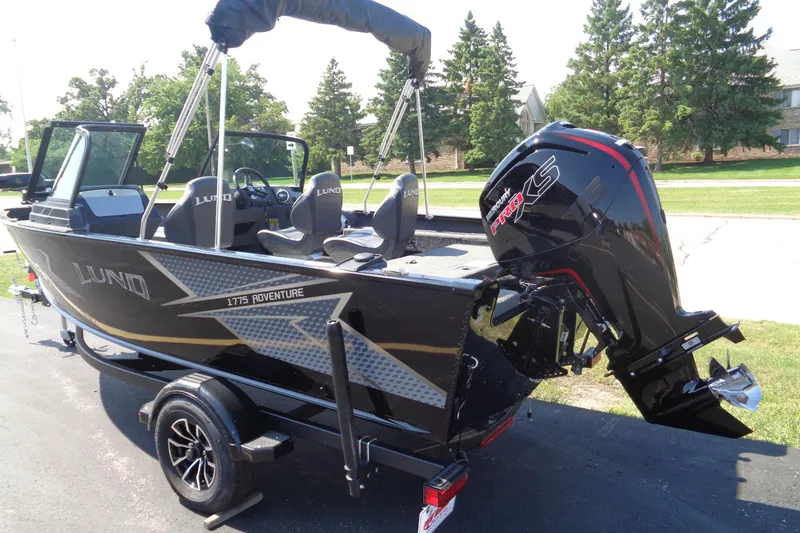 Slide: The Image of 2025 Lund 1775 Adventure Sport boat with Mercury Pro XS engine on a trailer. - 1