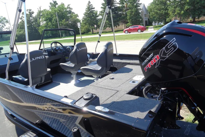 Slide: The Image of 2025 Lund 1775 Adventure Sport boat with Mercury Pro XS engine, interior view. - 2