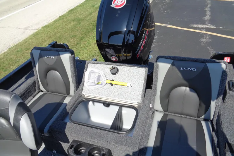 Slide: The Image of 2025 Lund 1775 Adventure Sport boat interior with seating and storage compartments. - 6