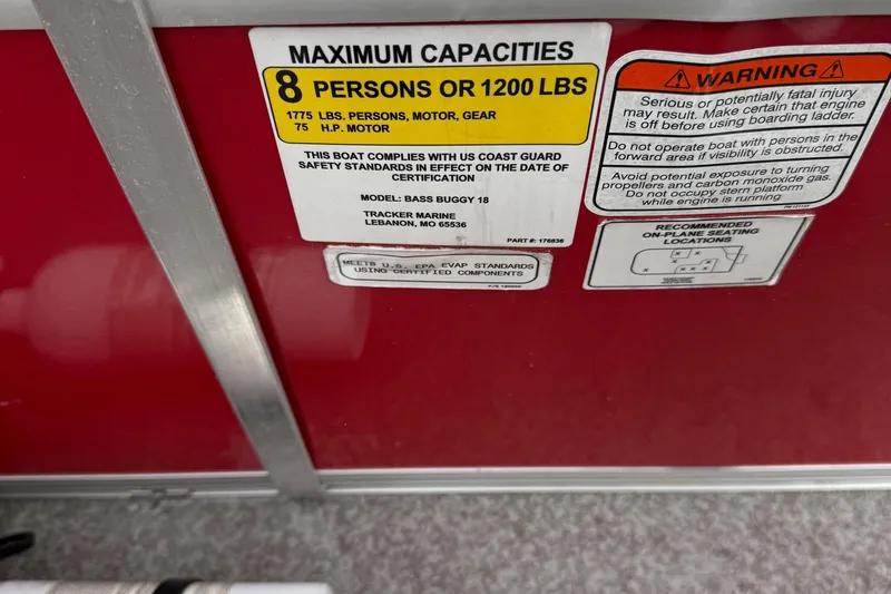 Slide: The Image of 2017 Sun Tracker Bass Buggy 18 DLX capacity and safety warning labels. - 13