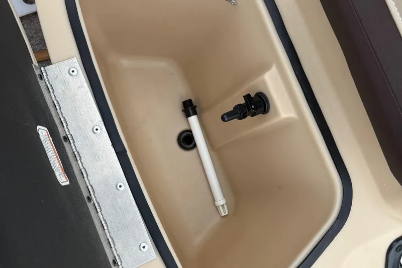 Slide: The Image of 2017 Sun Tracker Bass Buggy 18 DLX livewell interior with drain and aerator fittings. - 15