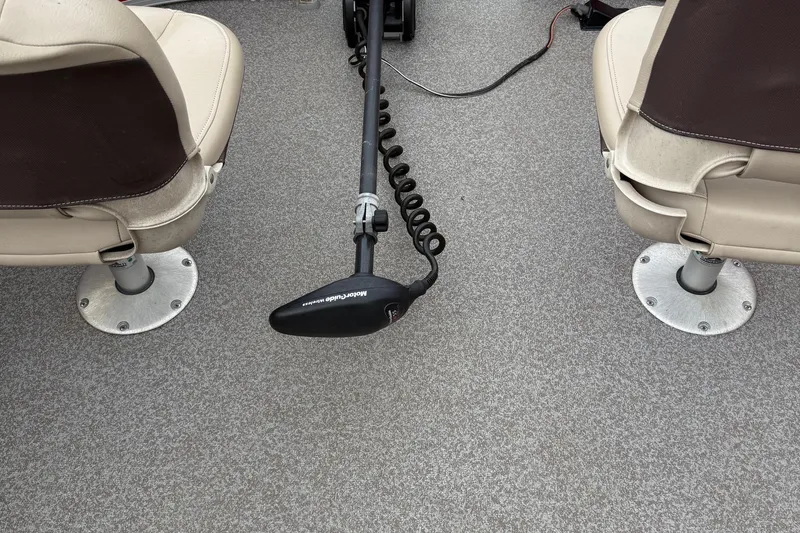 Slide: The Image of 2017 Sun Tracker Bass Buggy 18 DLX interior with two seats and a trolling motor. - 17