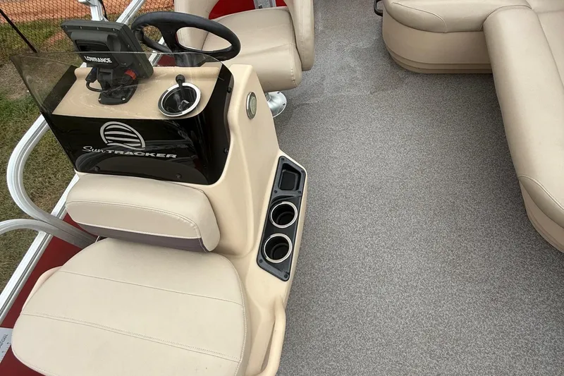 Slide: The Image of 2017 Sun Tracker Bass Buggy 18 DLX interior with steering console and seating. - 4