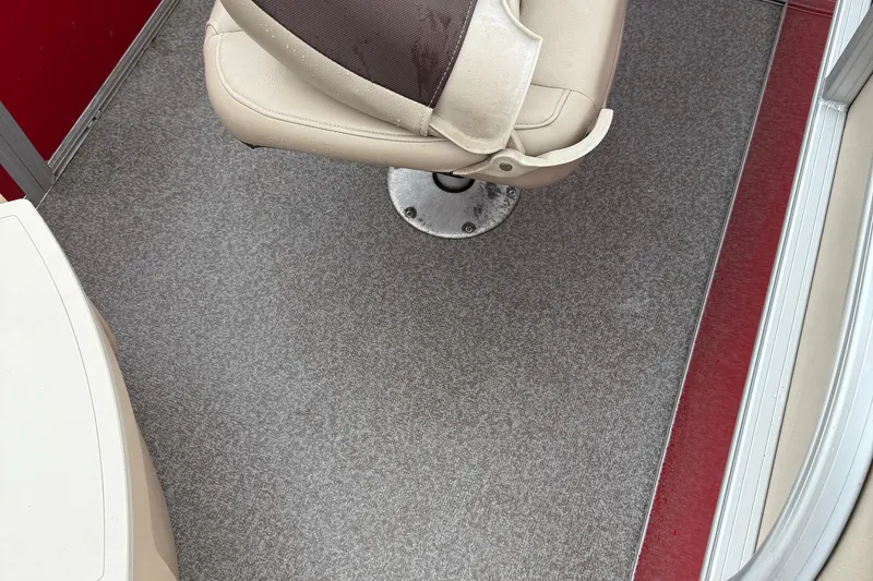 Slide: The Image of 2017 Sun Tracker Bass Buggy 18 DLX interior with beige seat and gray carpet. - 6