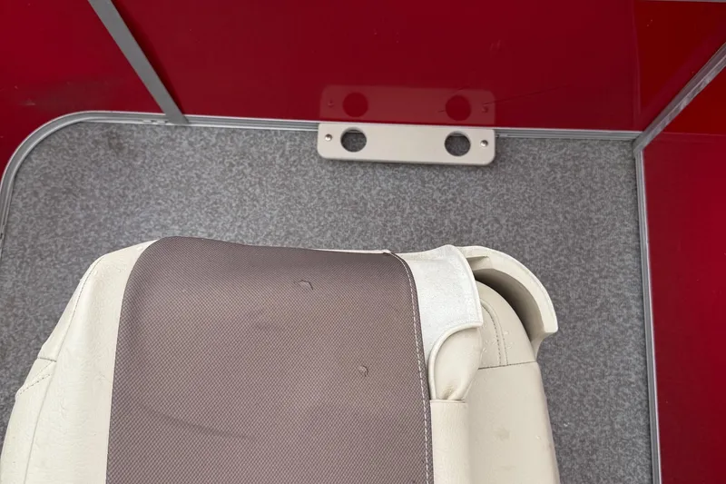 Slide: The Image of 2017 Sun Tracker Bass Buggy 18 DLX interior with seat and red paneling. - 9