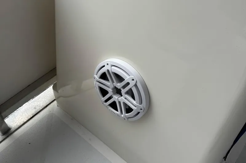 Slide: The Image of White speaker on 2022 Guthrie Boatworks A&M Custom Pontoon interior wall. - 15