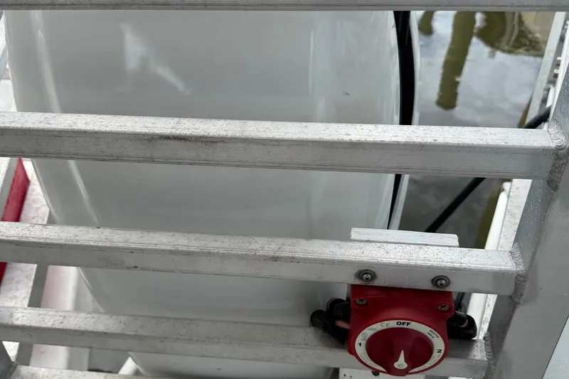 Slide: The Image of 2022 Guthrie Boatworks A&M Custom Pontoon with safety railing and red switch. - 19