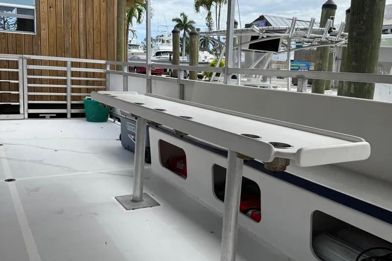 Slide: The Image of 2022 Guthrie Boatworks A&M Custom Pontoon with fishing rod holders and spacious deck. - 32