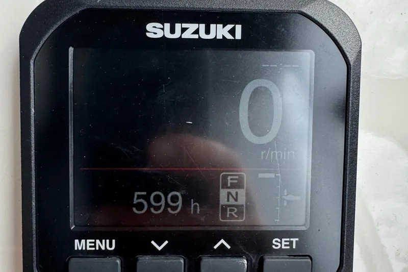 Slide: The Image of Suzuki display showing 599 hours on a 2022 Guthrie Boatworks A&M Custom Pontoon. - 49