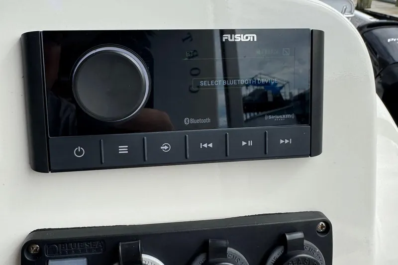 Slide: The Image of Fusion audio system on 2022 Guthrie Boatworks A&M Custom Pontoon dashboard. - 51