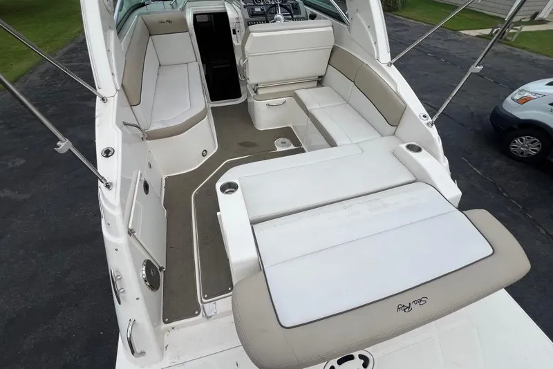Slide: The Image of 2015 Sea Ray 260 Sundancer boat interior with spacious seating and modern design. - 13
