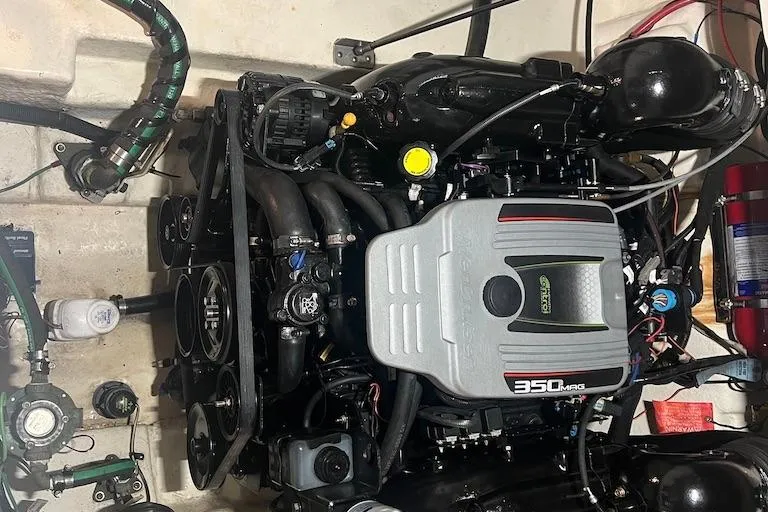 Slide: The Image of Engine of a 2015 Sea Ray 260 Sundancer boat, featuring a 350 MAG motor. - 15