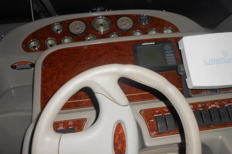 Slide: The Image of 1999 Bayliner 3055 Ciera dashboard with steering wheel and navigation instruments. - 20