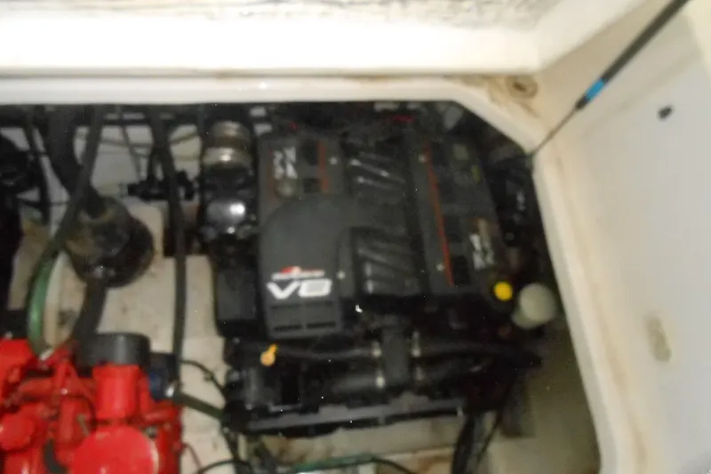 Slide: The Image of 1999 Bayliner 3055 Ciera engine compartment with V8 engine visible. - 22