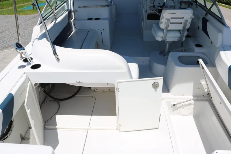 Slide: The Image of 2007 Glacier Bay 2240 boat interior with seating and storage compartments. - 12
