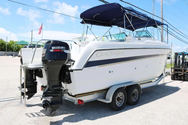 Slide: The Image of 2007 Glacier Bay 2240 boat with Suzuki outboard motor on trailer. - 2