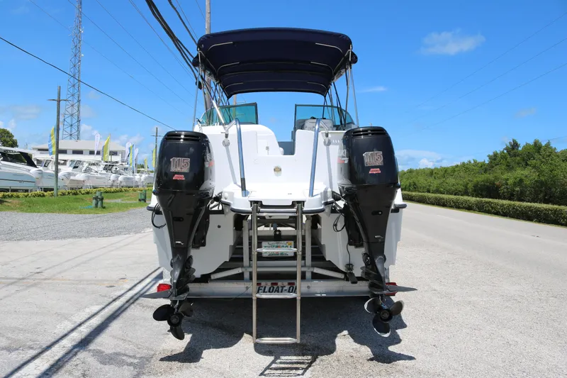 Slide: The Image of 2007 Glacier Bay 2240 boat with twin outboard motors on a trailer. - 3