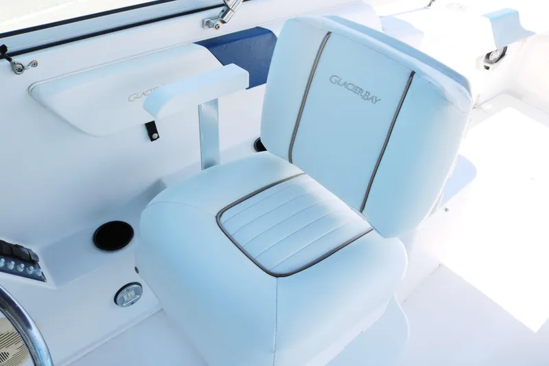 Slide: The Image of White leather seat on 2007 Glacier Bay 2240 boat, featuring sleek design and branding. - 6